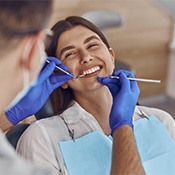 woman smiling and having a dental checkup