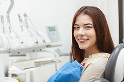 woman smiling in the dentist chair